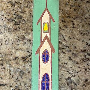 Folk art painting of church on wood